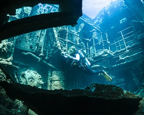 bigstock-Scuba-diver-exploring-the-inte-170166560_BAJA
