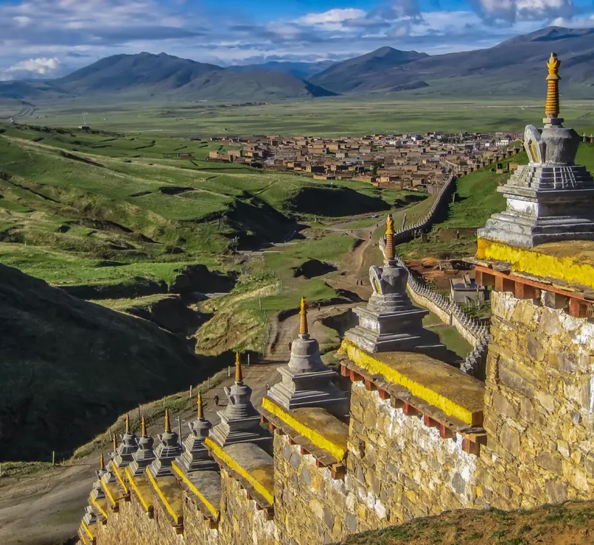 bigstock-Wall-With-Stupas-And-Distant-T-50365217_BAJA